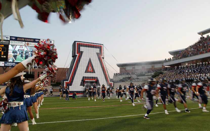 The Allen Eagles take the field for their first game of the new season during as Allen High...