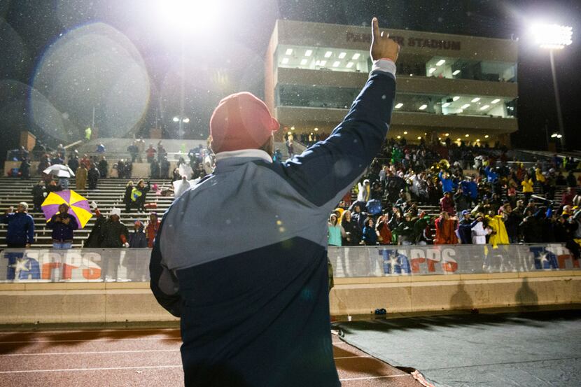 Bishop Dunne head coach Michael Johnson celebrates after winning the TAPPS Division I state...