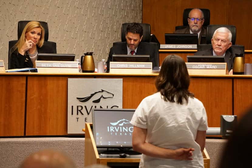 Irving Mayor Beth Van Duyne listens to residents speak out against a chicken ordinance...