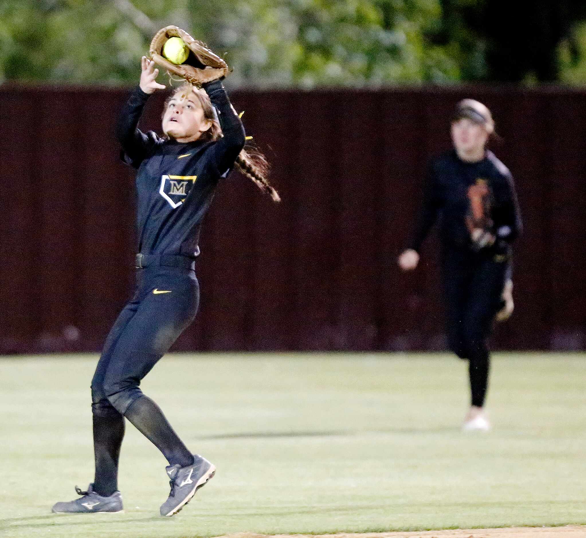 Memorial second baseman Ashley Camacho (2) makes a catch in shallow center field during the...