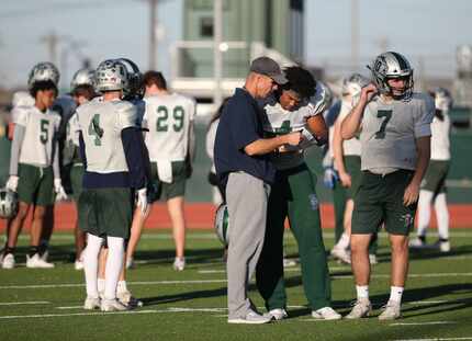 Head coach Chad Cole talks to players during Frisco Reedy's practice at Rick Reedy High...
