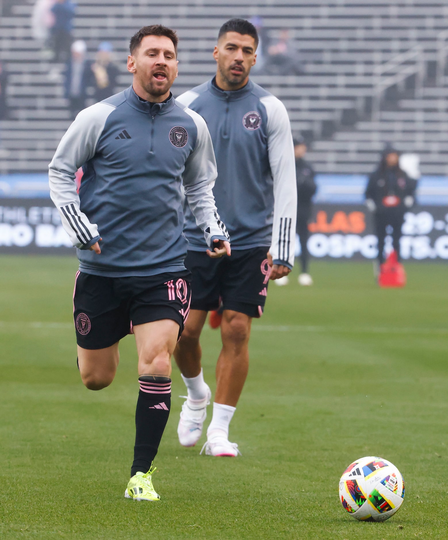 Inter Miami forward Lionel Messi (left) and Inter Miami forward Luis Suárez warm up ahead of...