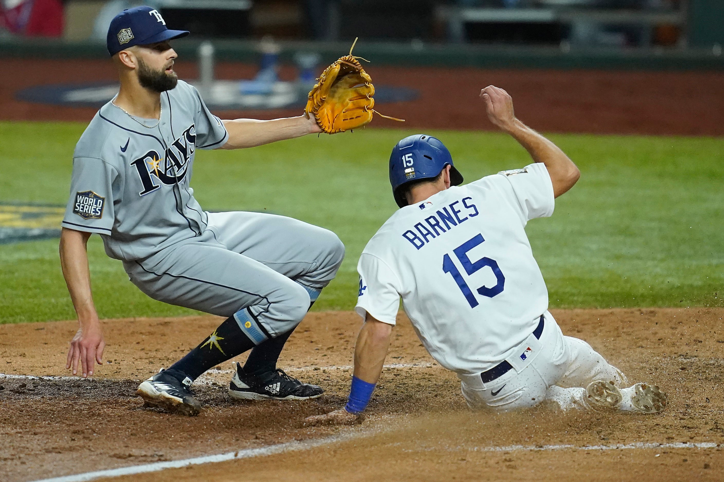 Los Angeles Dodgers catcher Austin Barnes (15) scores past Tampa Bay Rays relief pitcher...