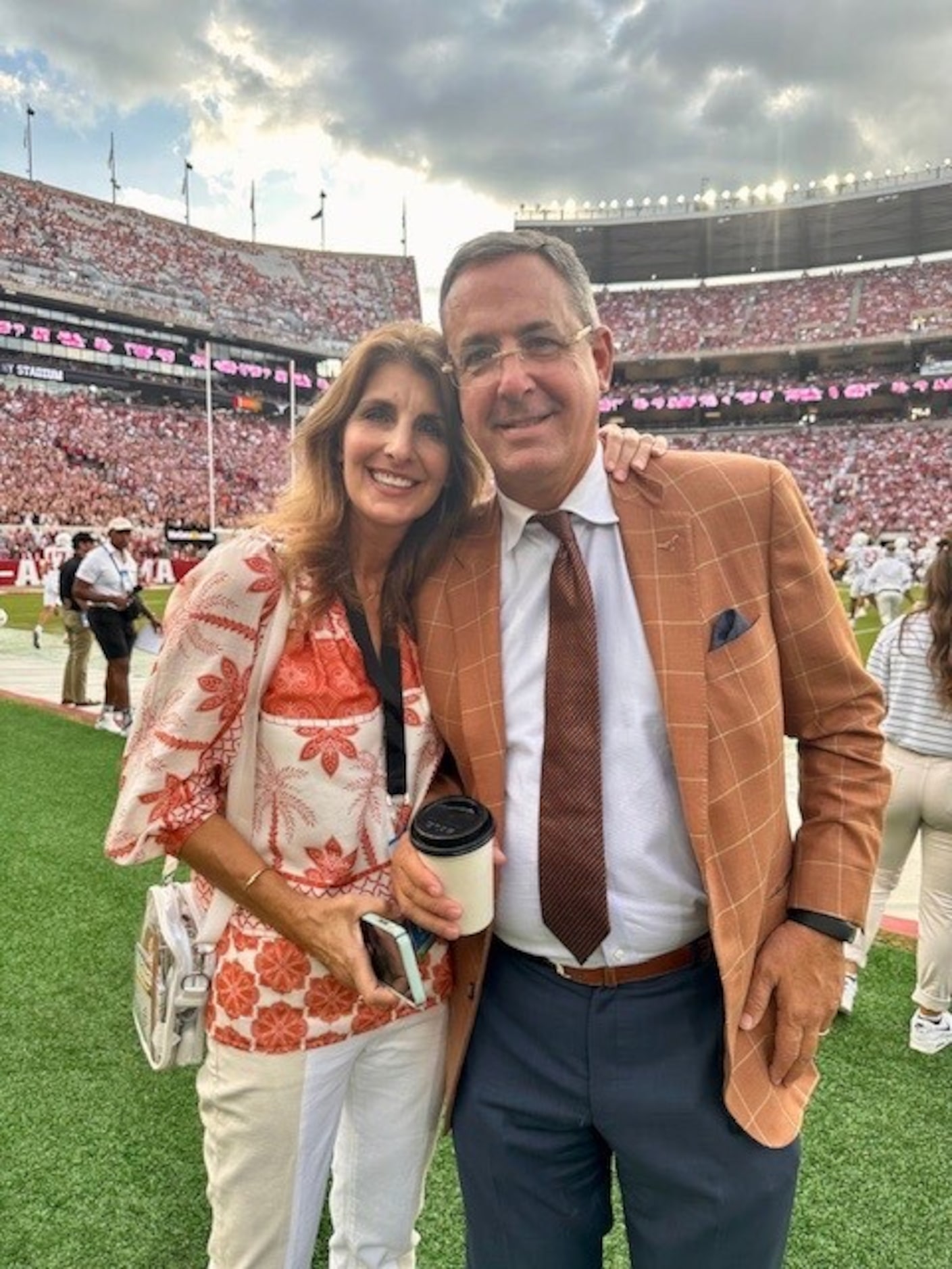 Texas athletic director Chris Del Conte and wife Robin on the sideline of a Texas football...