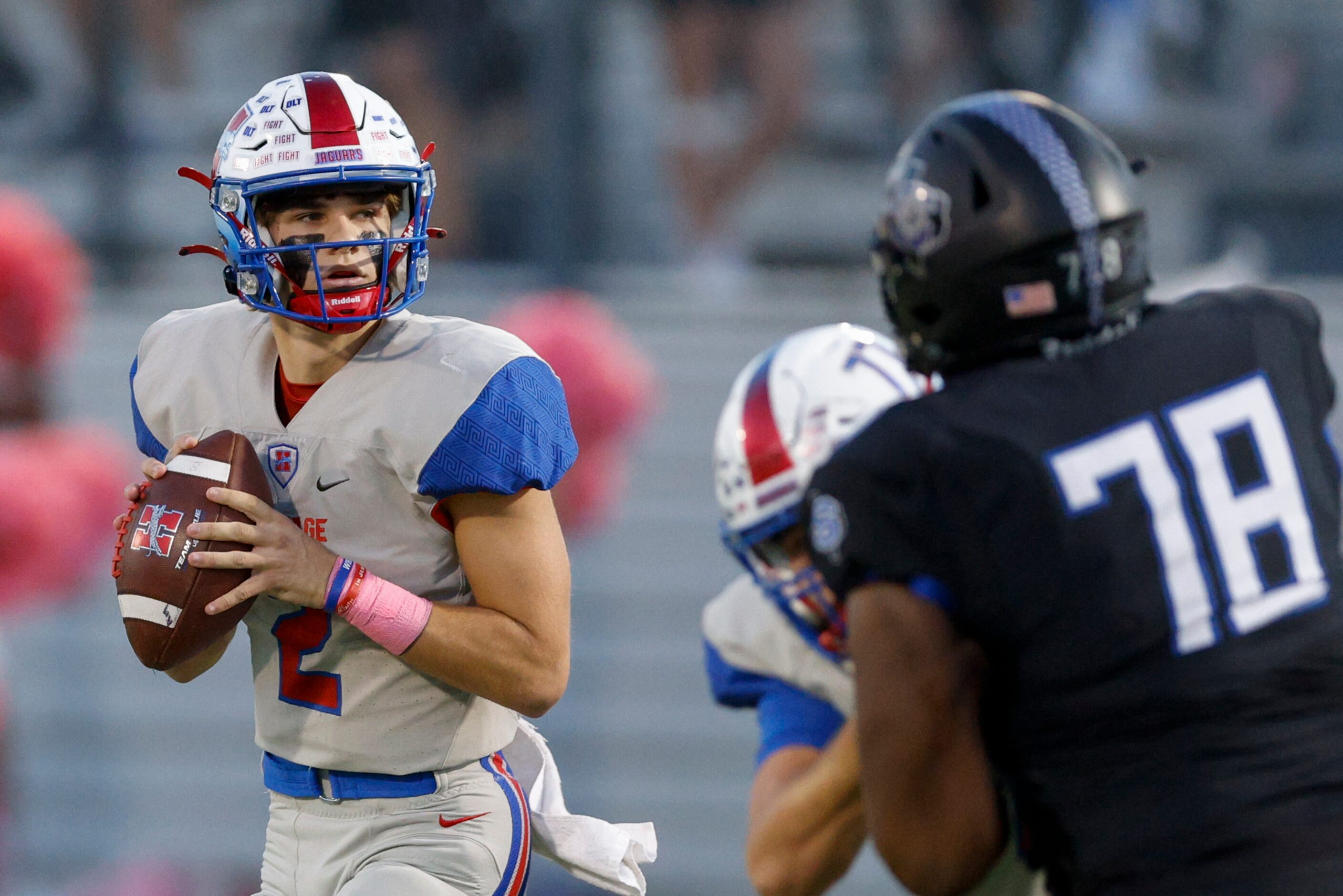 Midlothian Heritage quarterback Kaden Brown (2) looks to pass as Mansfield Summit defensive...