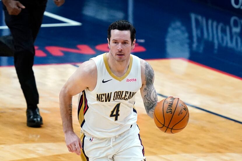 New Orleans Pelicans guard JJ Redick (4) moves the ball up court in the first half of an NBA...