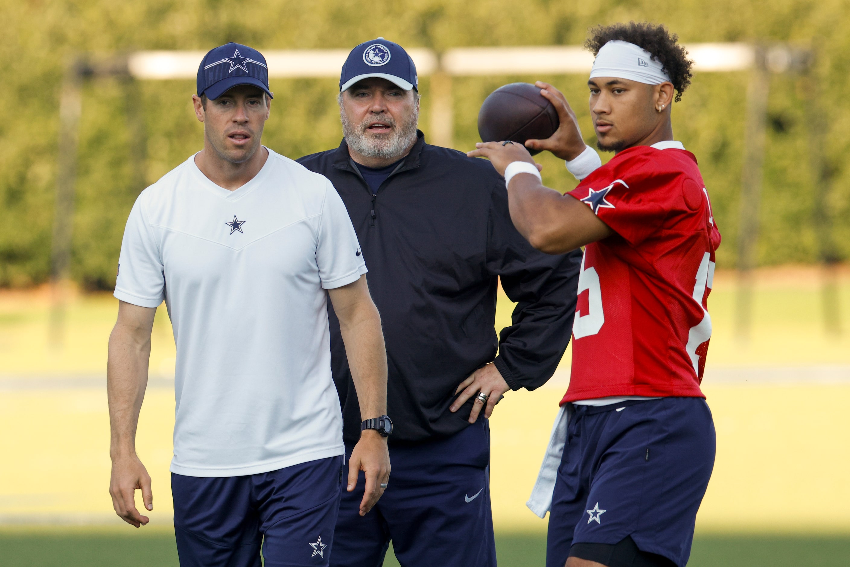 Dallas Cowboys quarterbacks coach Scott Tolzien (left) and head coach Mike McCarthy watch as...