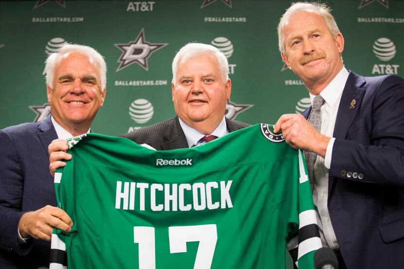 Ken Hitchcock poses for a photo with team president Jim Lites (left) and general manager Jim...