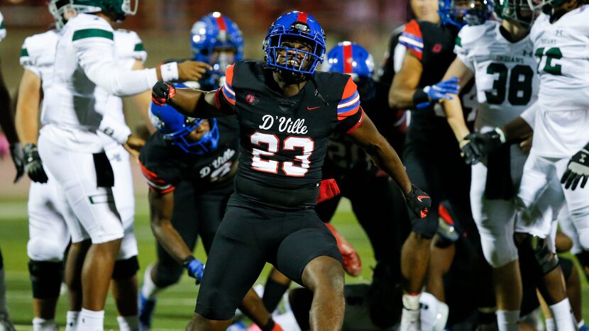 Duncanville senior defensive lineman Omari Abor (23) celebrates a Waxahachie fumble and...