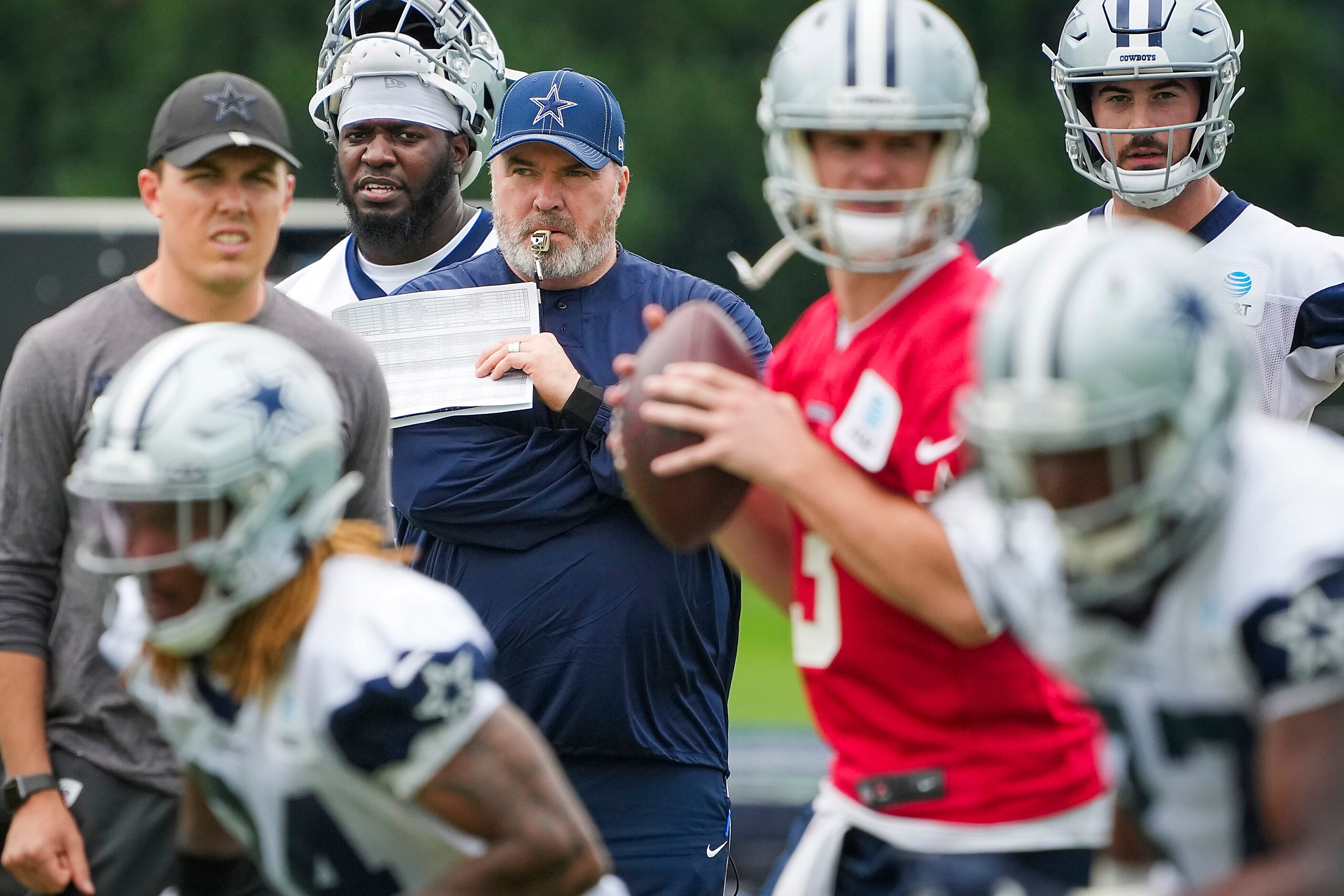 Dallas Cowboys head coach Mike McCarthy )(center) and offensive coordinator Kellen Moore...