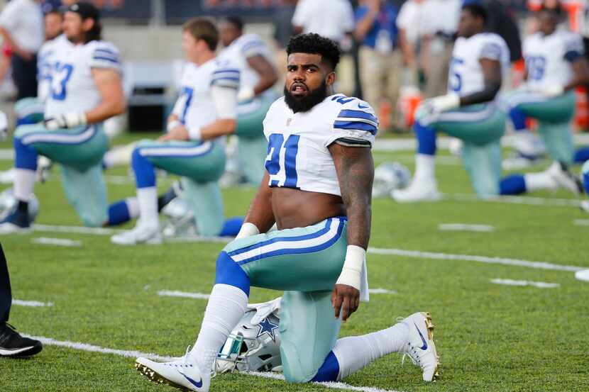 Dallas Cowboys running back Ezekiel Elliott (21) stretches with the team before the Hall of...