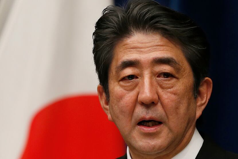 Then Japan's new Prime Minister Shinzo Abe speaks during his first press conference at the...