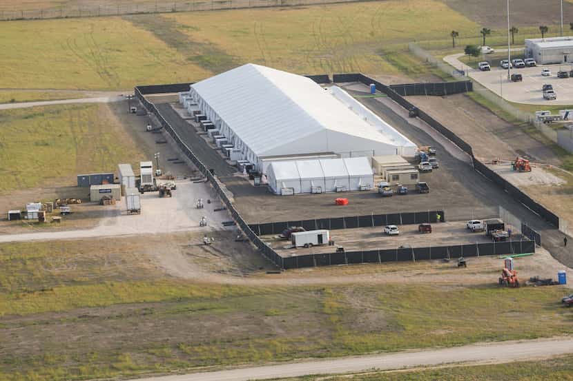 A temporary holding facility near the Donna-Rio Bravo International Bridge is seen from the...