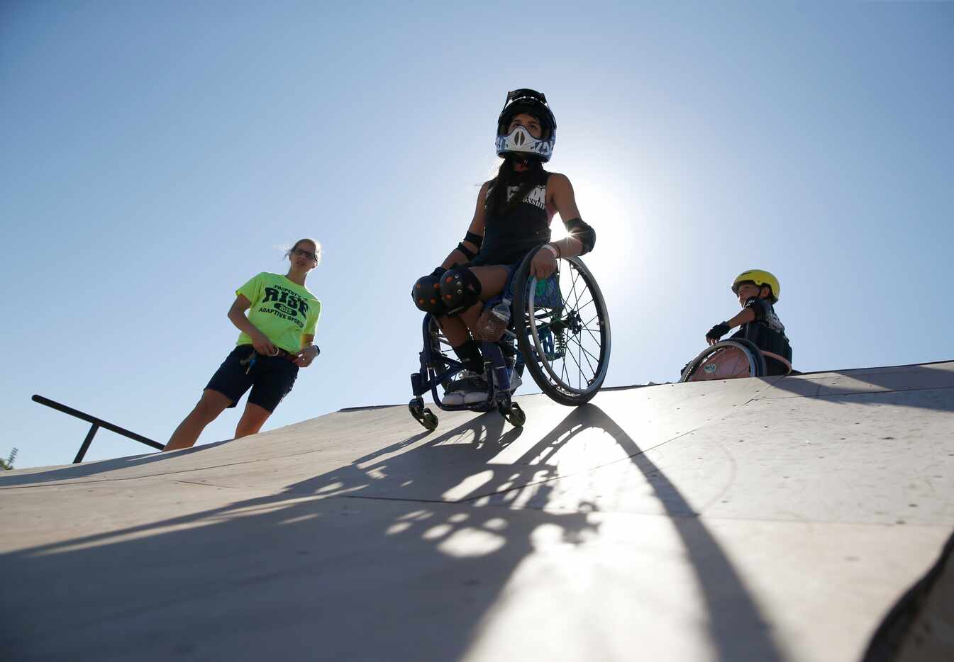 Ella Frech rolls down a ramp during a Children's Wheelchair Interactive Clinic at Alliance...