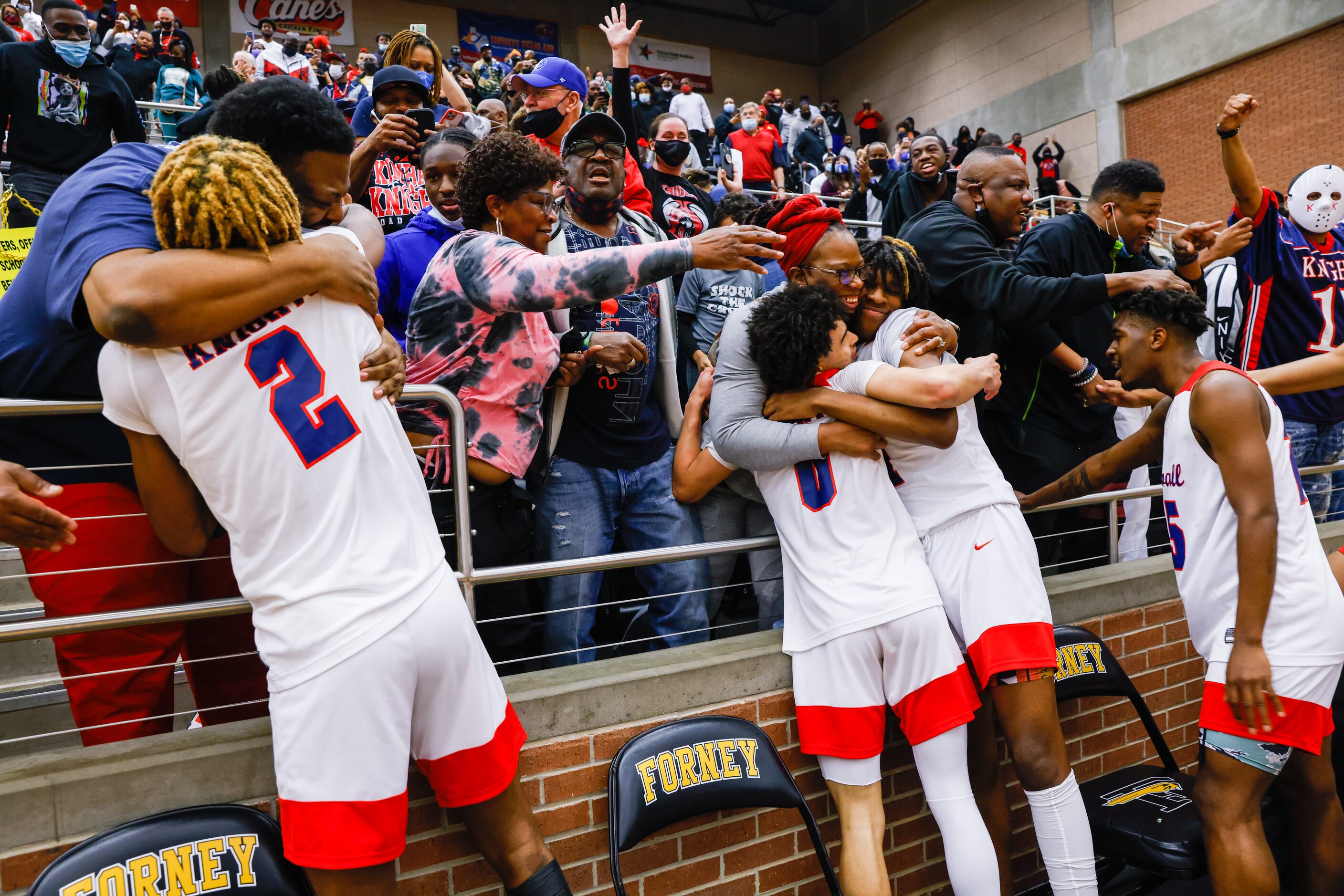 Kimball celebrates their win over Lancaster following overtime of a boys basketball UIL...