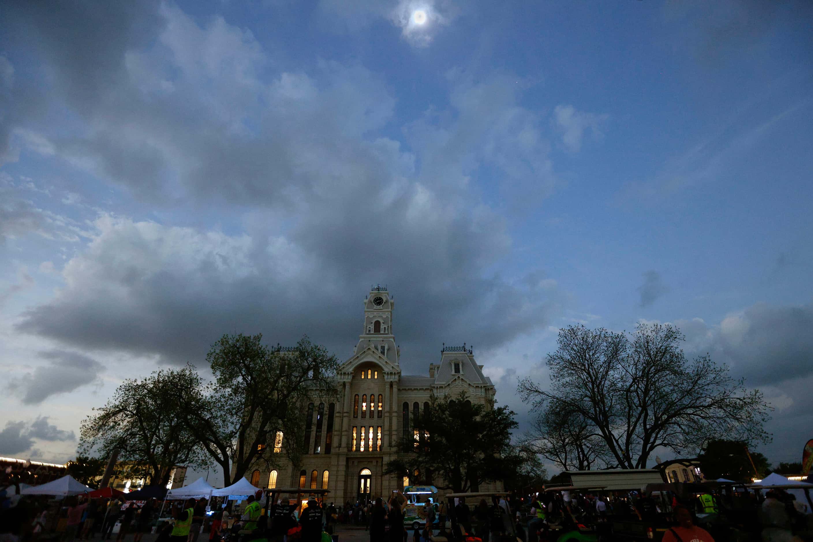The Hill County Courthouse is seen during a total solar eclipse, Monday, April 8, 2024, in...