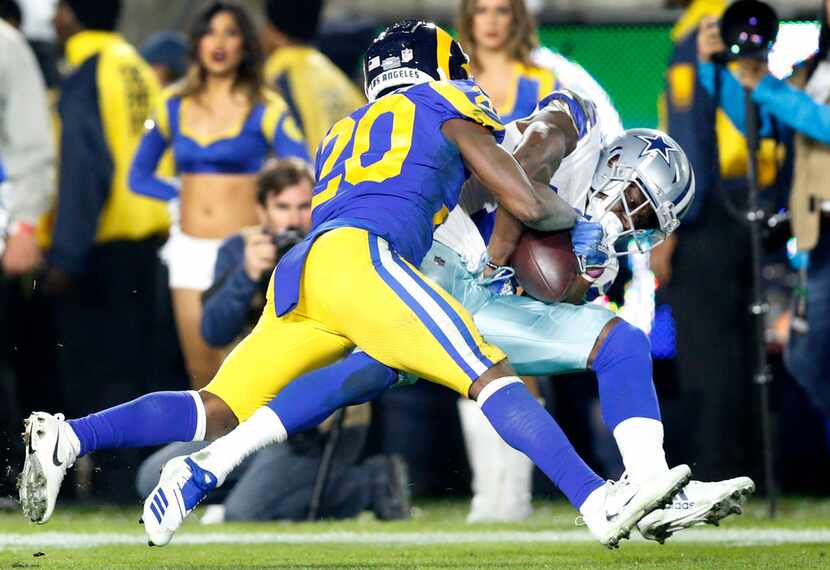 Dallas Cowboys wide receiver Michael Gallup (13) hangs onto a third quarter pass caught over...