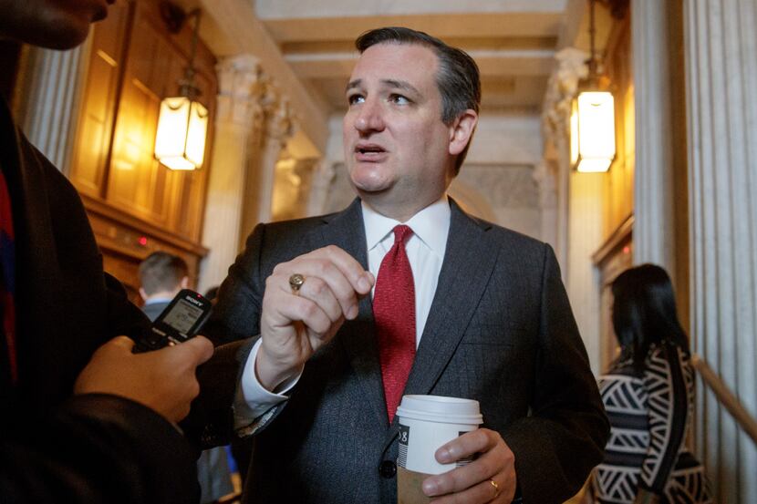 Sen. Ted Cruz, R-Texas talks to reporters as he leaves the Senate chamber on Capitol Hill in...