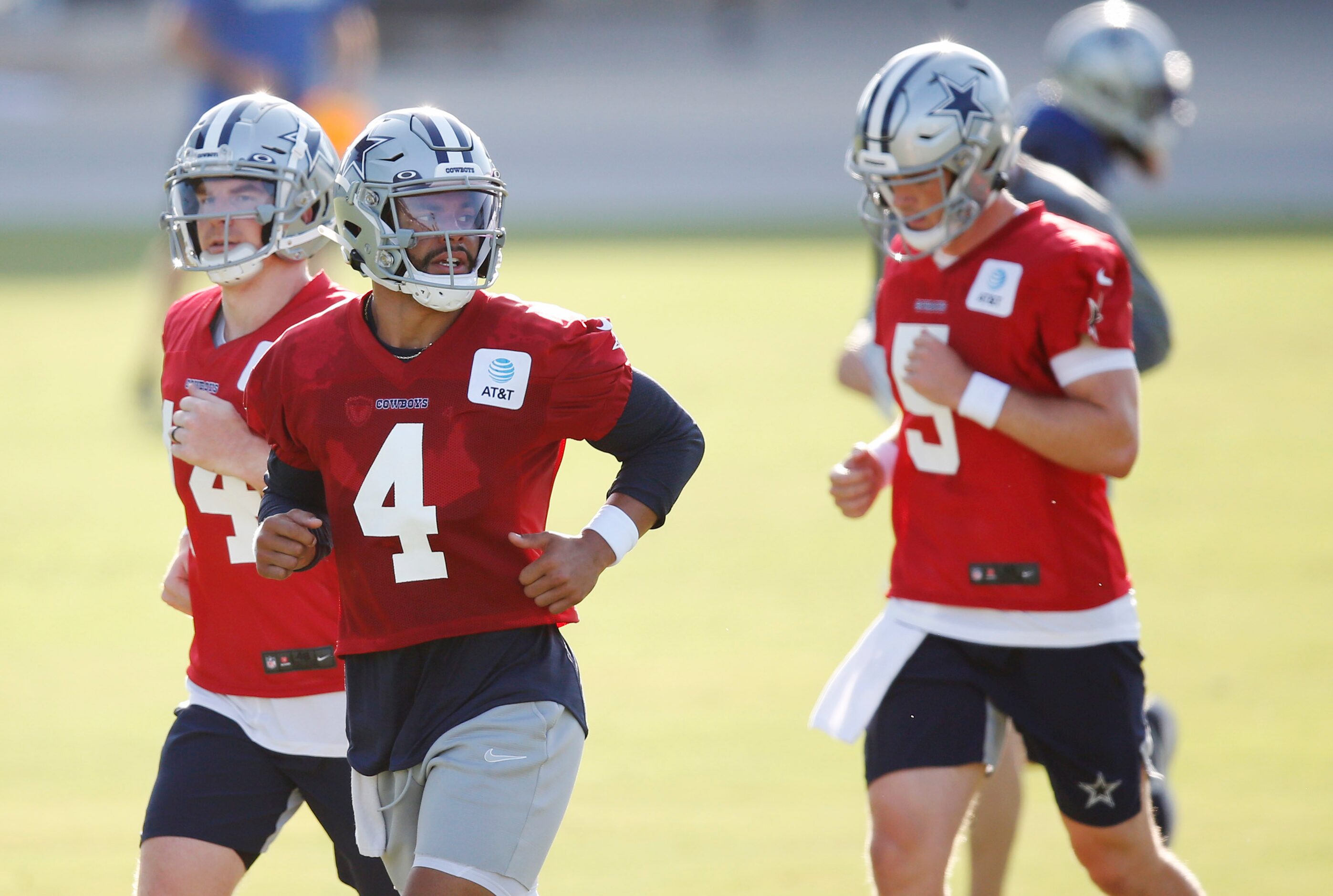 Dallas Cowboys quarterback Dak Prescott (4), Dallas Cowboys quarterback Andy Dalton (14) and...