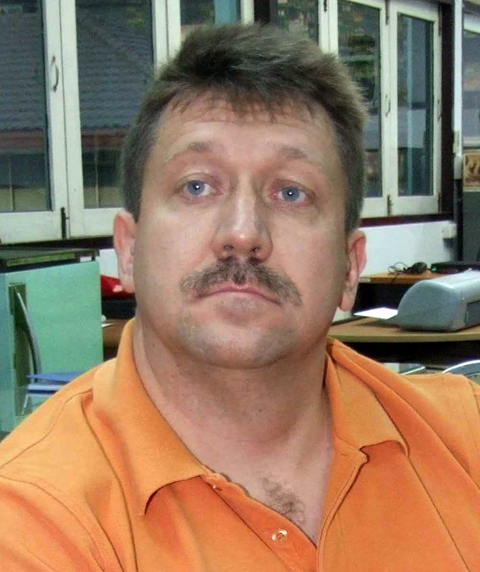 Suspected Russian arms dealer Viktor Bout sits at the head of the Crime Suppression Bureau...