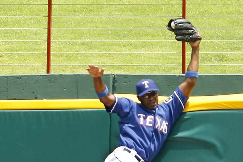 FILE - Rangers center fielder Gary Matthews Jr. robs the Astros' Mike Lamb of a home run in...