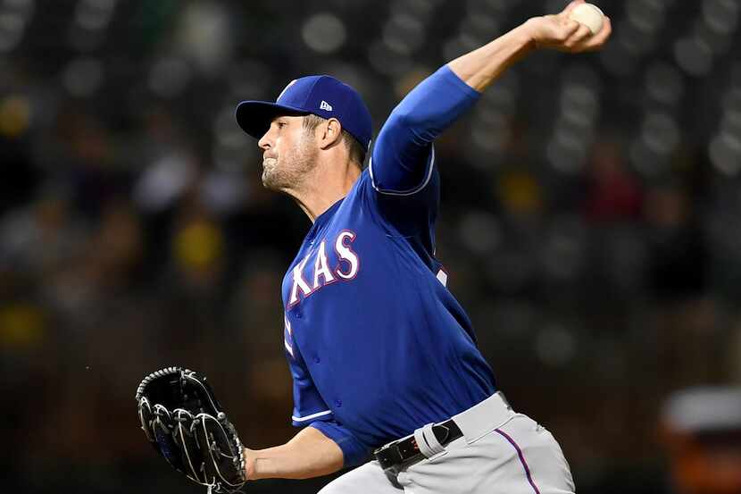 OAKLAND, CA - APRIL 03:  Cole Hamels #35 of the Texas Rangers pitches against the Oakland...
