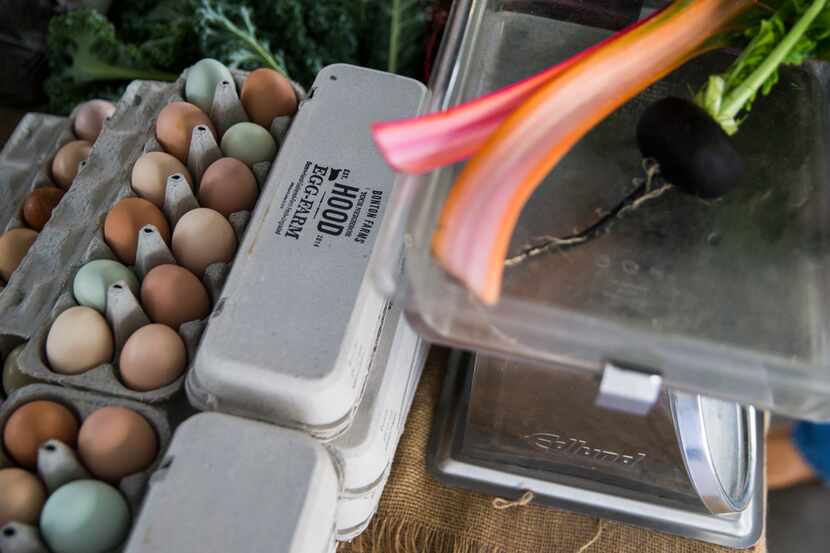Fresh eggs, along with chard and radishes from Bonton Farms is on sale at the Dallas Farmers...