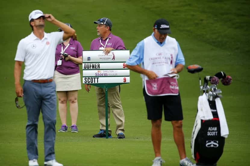 The score was all tied at (-under as Adam Scott, left, and Jason Dufner played the 18th hole...