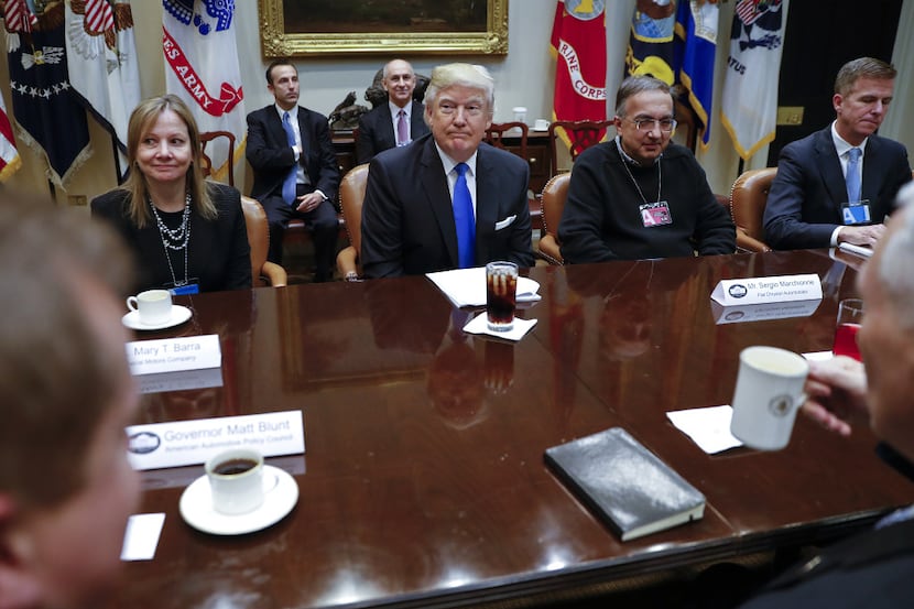 U.S. President Donald Trump, second left, Mary Barra, chief executive officer of General...