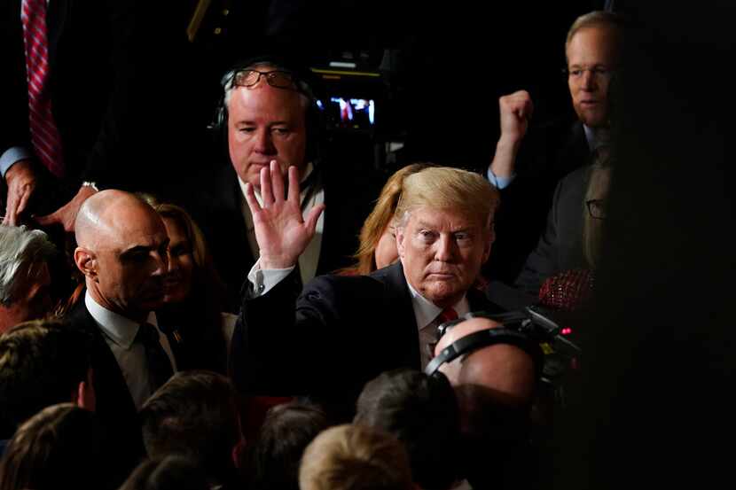 President Donald Trump waves as he leaves after delivering his State of the Union address to...