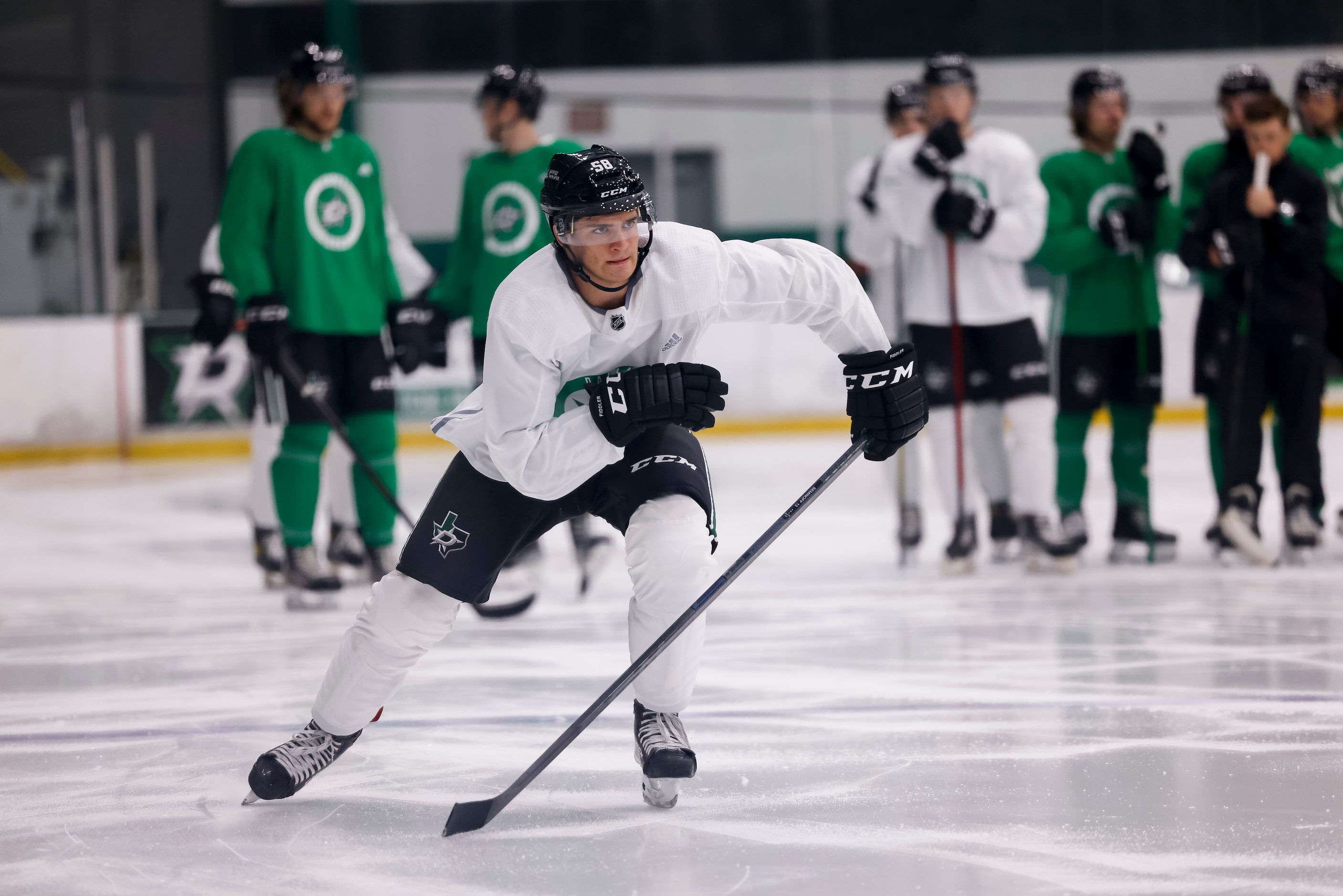 Matthew Seminoff (58) participates in a drill during the Stars’ annual development camp...