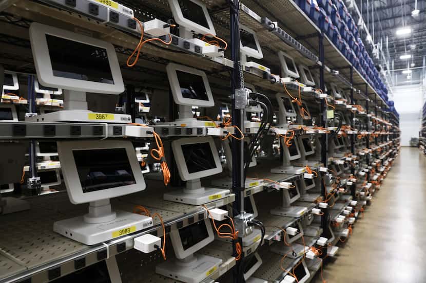 Rows of machines used by poll workers, Thursday, Oct. 6, 2022 at Dallas County Election...
