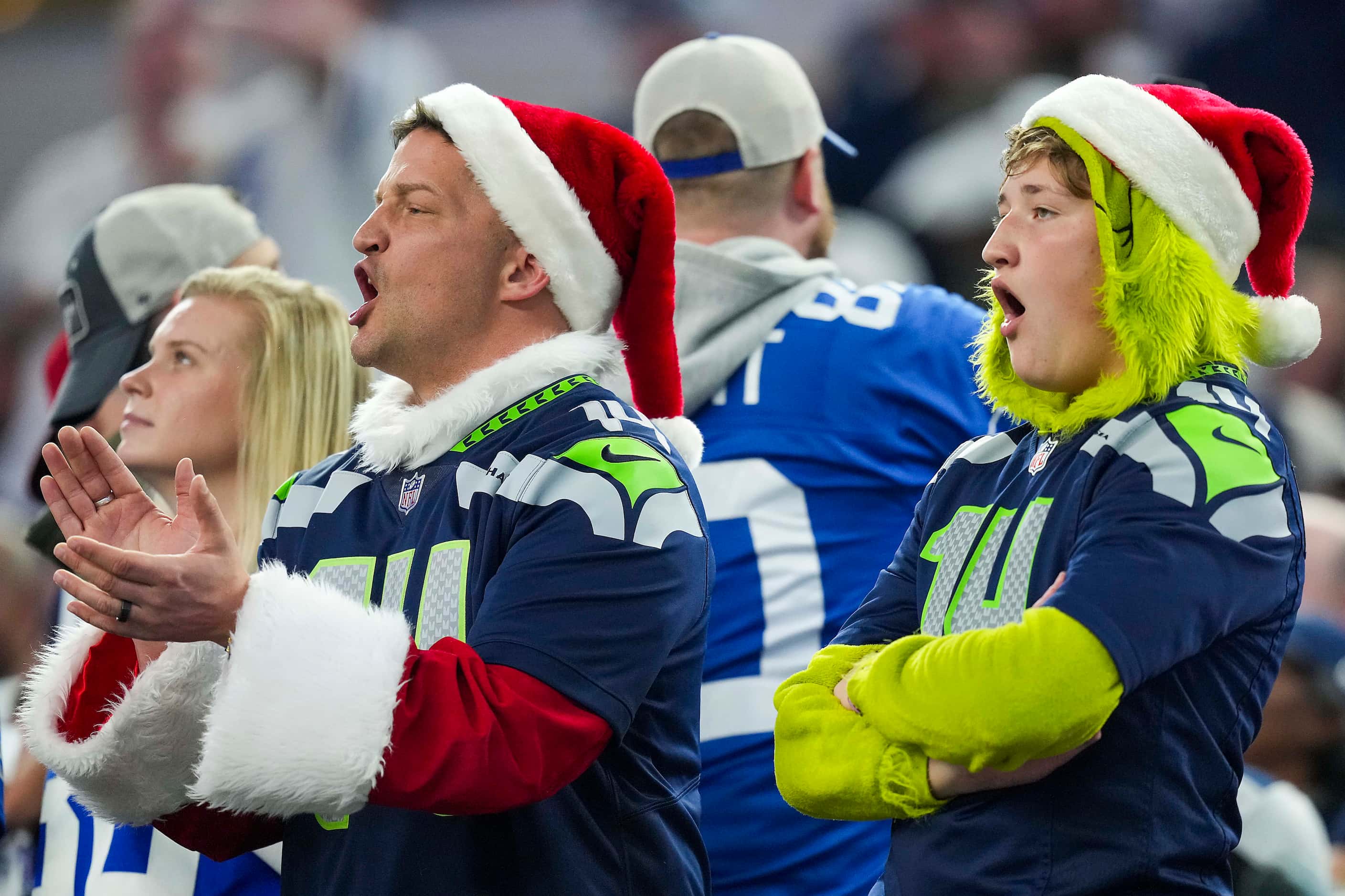 Seattle Seahawks fans react during the first quarter of an NFL football game against the...