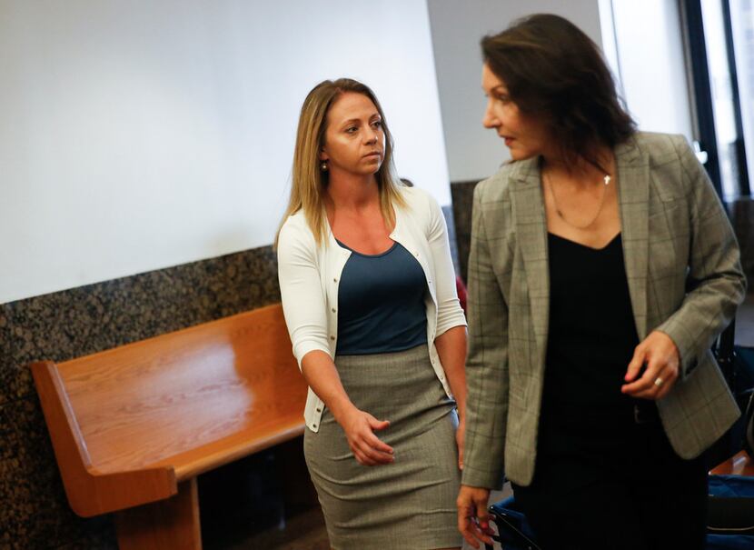 Former Dallas police Officer Amber Guyger (left) entered the 204th District Court in the...