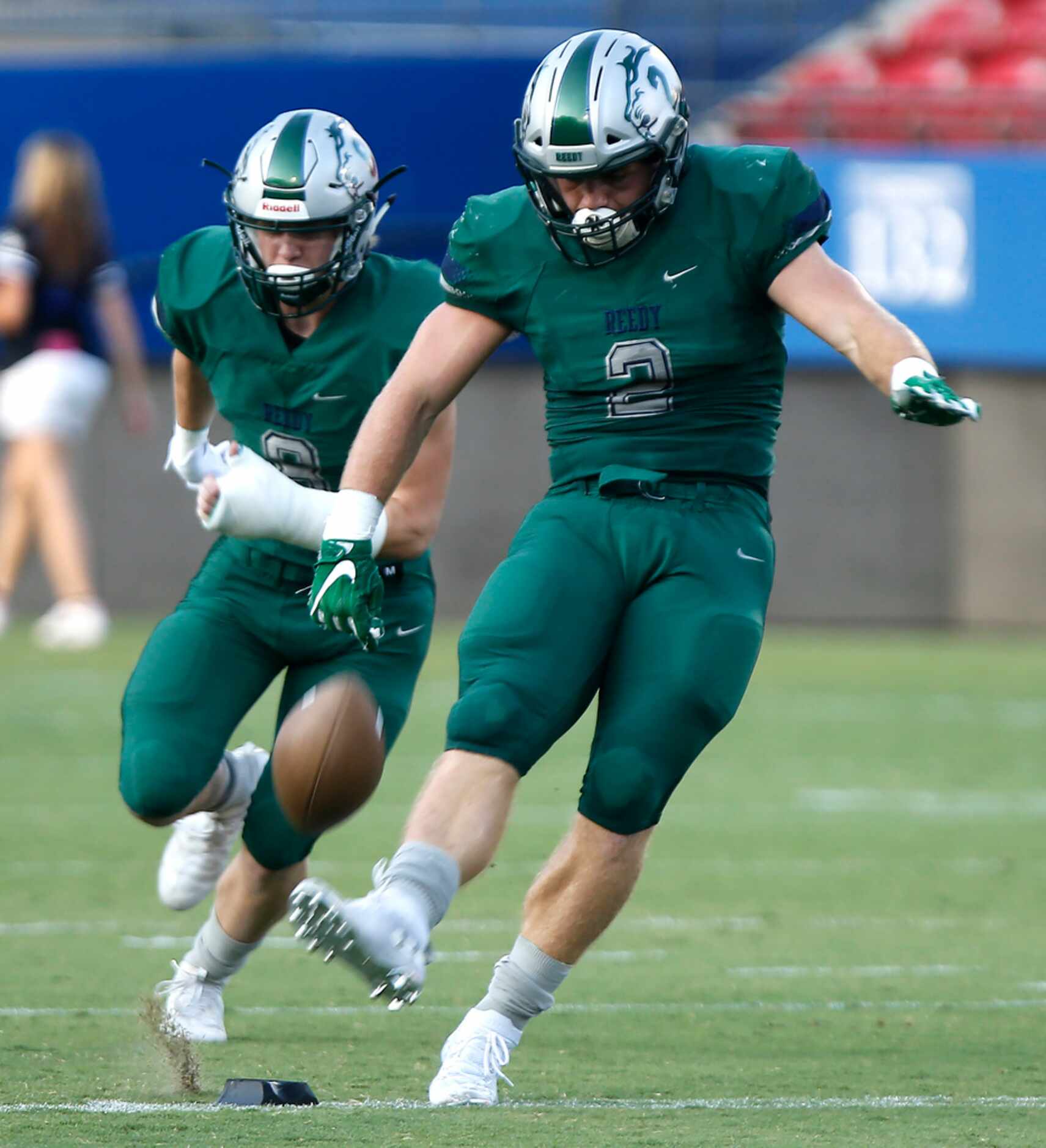 Reedy High School kicker Will Harbour (2) opens the season with kickoff as Reedy High School...