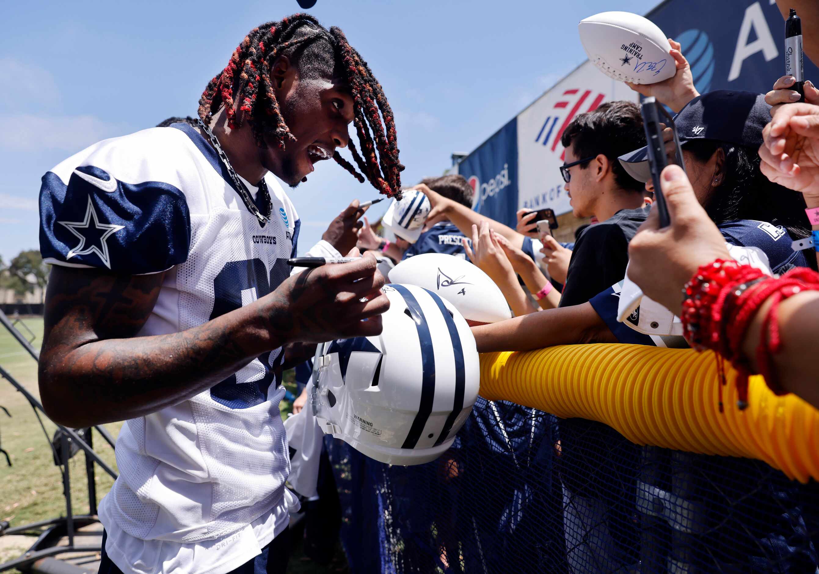 Dallas Cowboys wide receiver CeeDee Lamb (88) signs autographs for fans following the first...