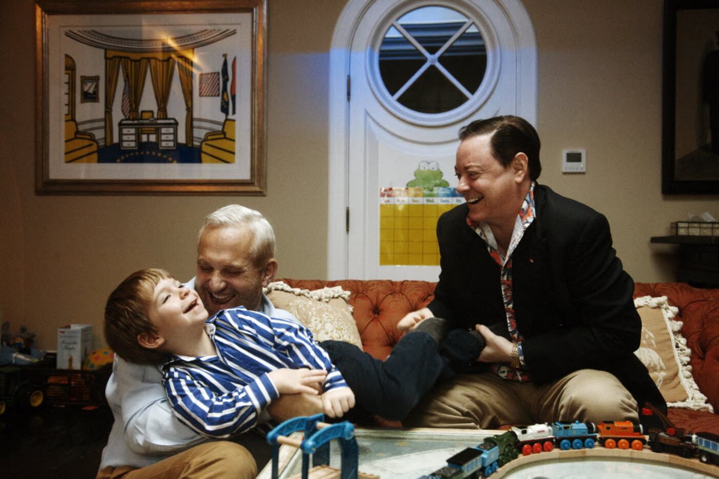 Author Andrew Solomon, right, with his husband, John Habich, and their son, George, 3, at...