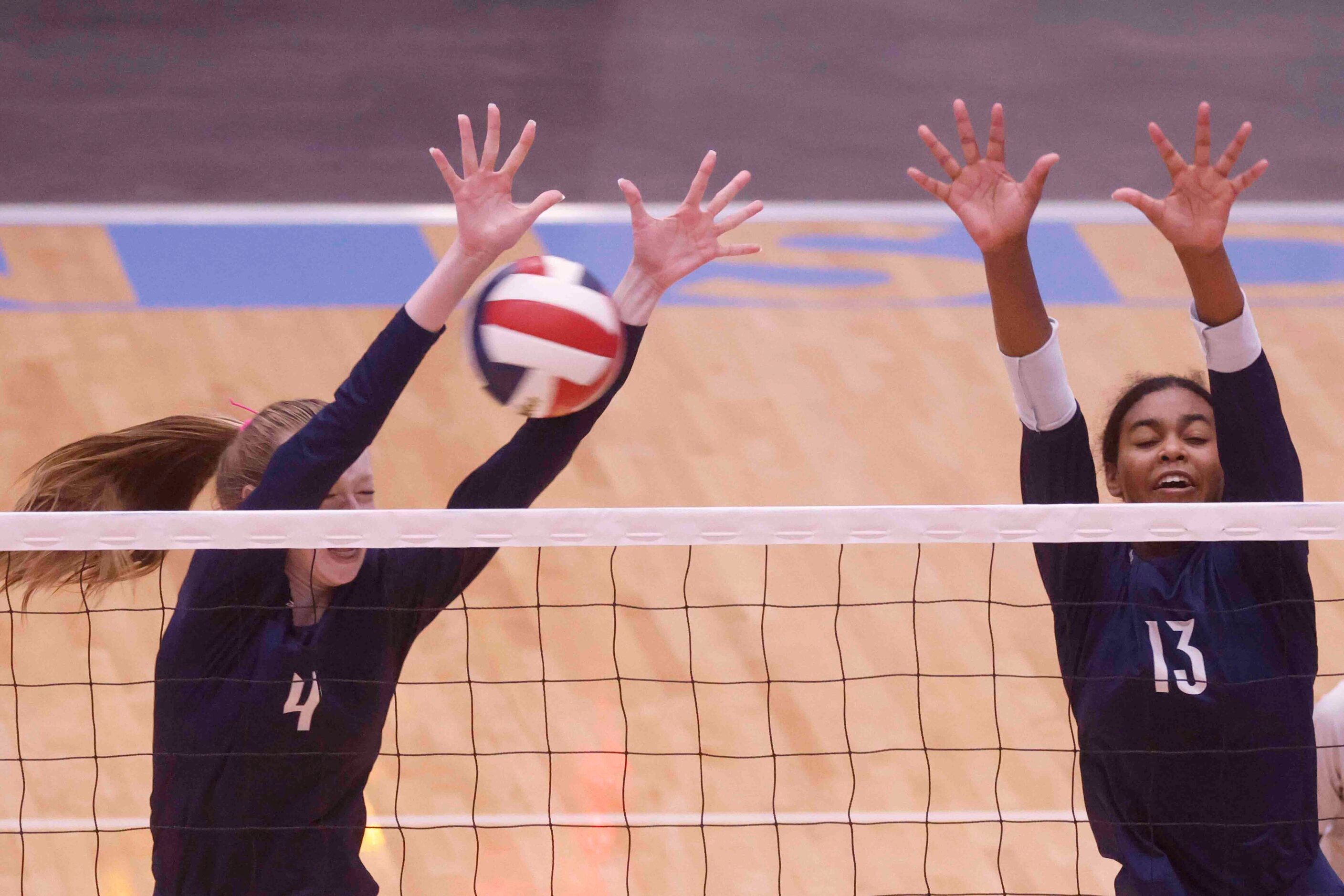 Flower Mound’s Caroline Tredwell (4) and Brianna Watson (13) blocks against Highland Park...