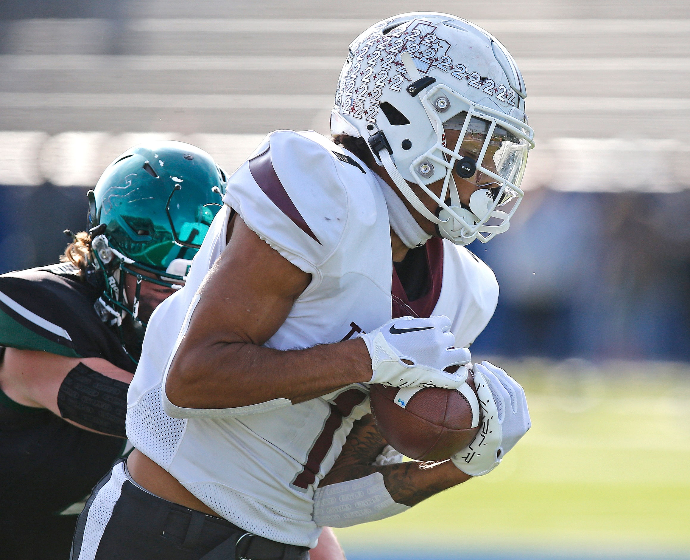 Lewisville High School wide receiver Jaydan Hardy (1) pulls in a catch before heading to the...