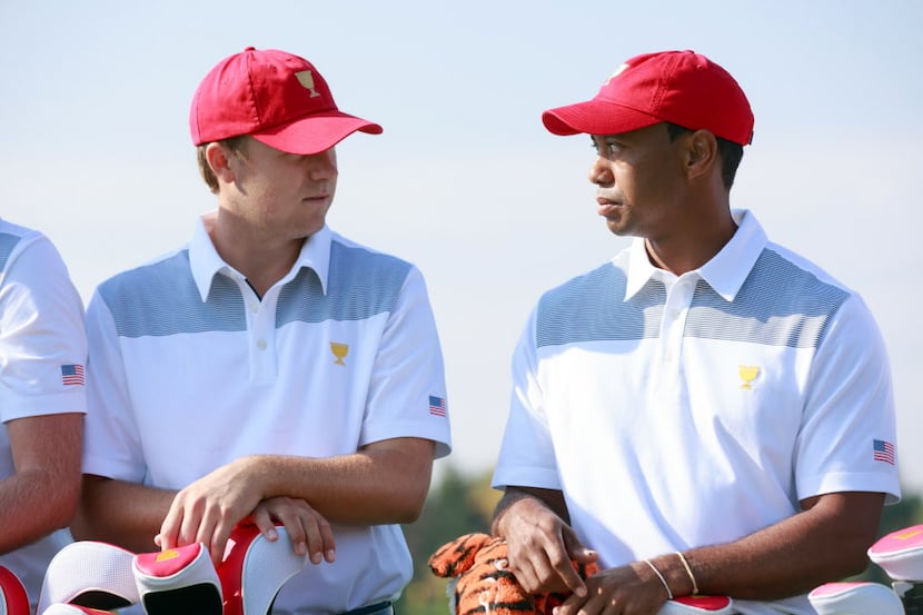 Oct 1, 2013; Dublin, OH, USA;  Tiger Woods (right) with Jordan Spieth (left) of the U.S....