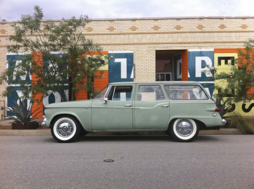 Baker's 1960s Studebaker Lark parked in front of his office
