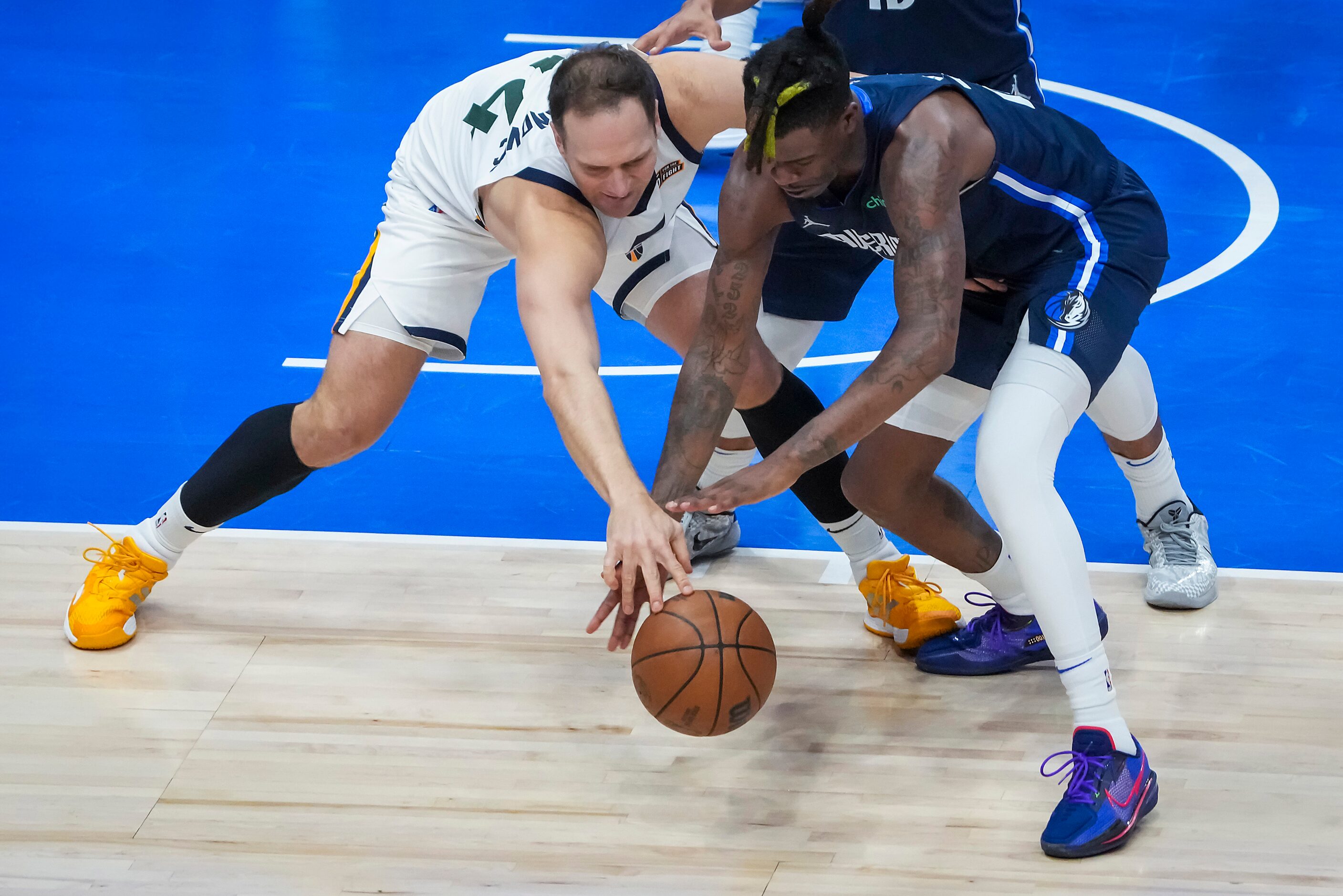 Dallas Mavericks forward Reggie Bullock (25) steals the ball from Utah Jazz forward Bojan...