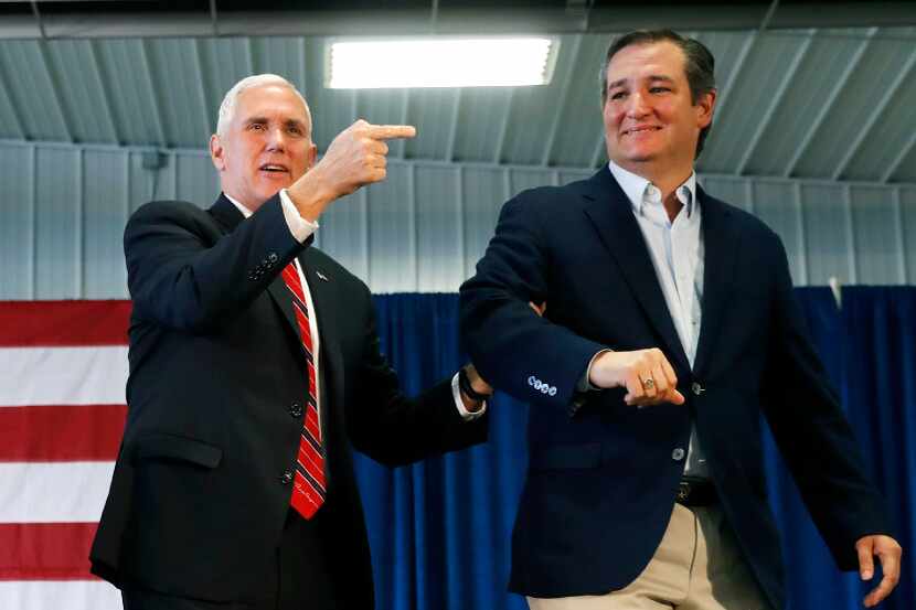Republican vice presidential candidate Mike Pence walked on stage with Sen. Ted Cruz,...