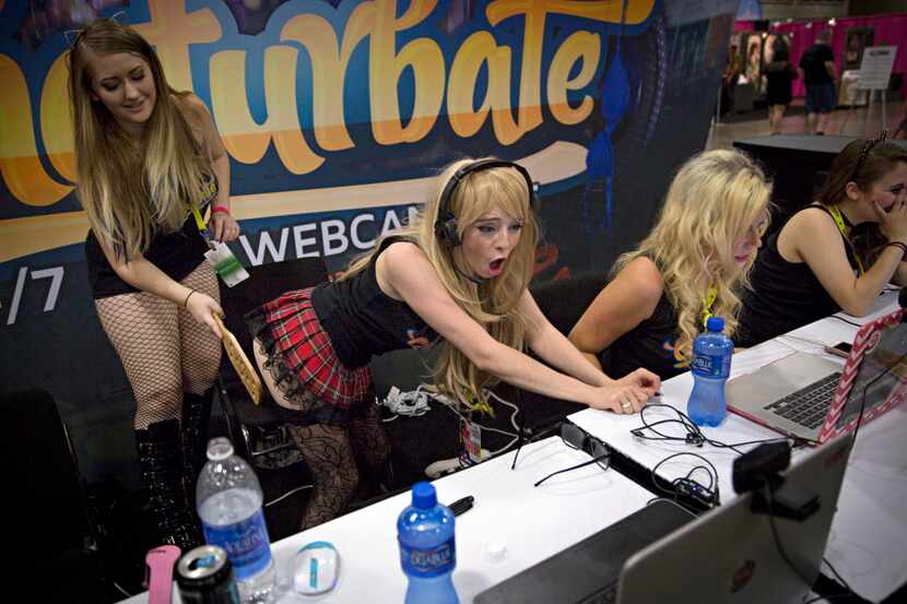  Women perform on live webcams during the Exxxotica Expo 2015 Friday, August 7, 2015 at the...