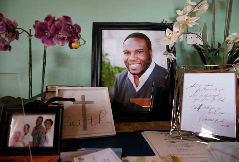 A large photo of Botham Jean was displayed with photos and cards in his childhood home in...