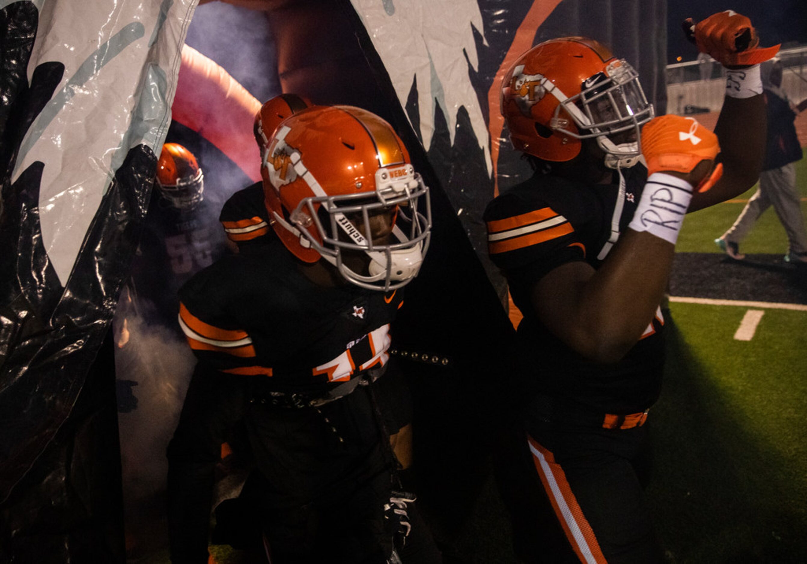 Lancaster players enter the field before a District 6-5A Division I high school football...