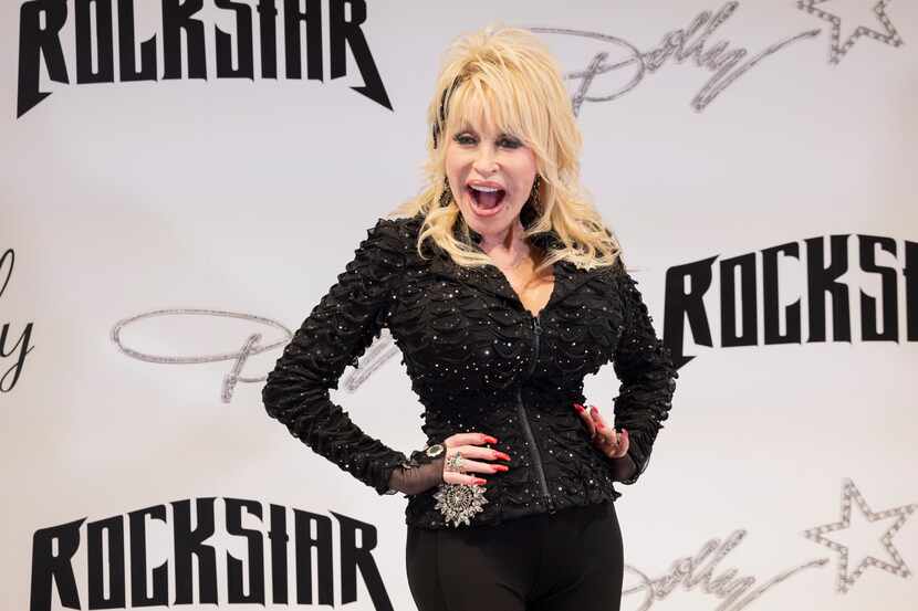 Dolly Parton poses for photos during a press conference for her pop-up store to kick off the...