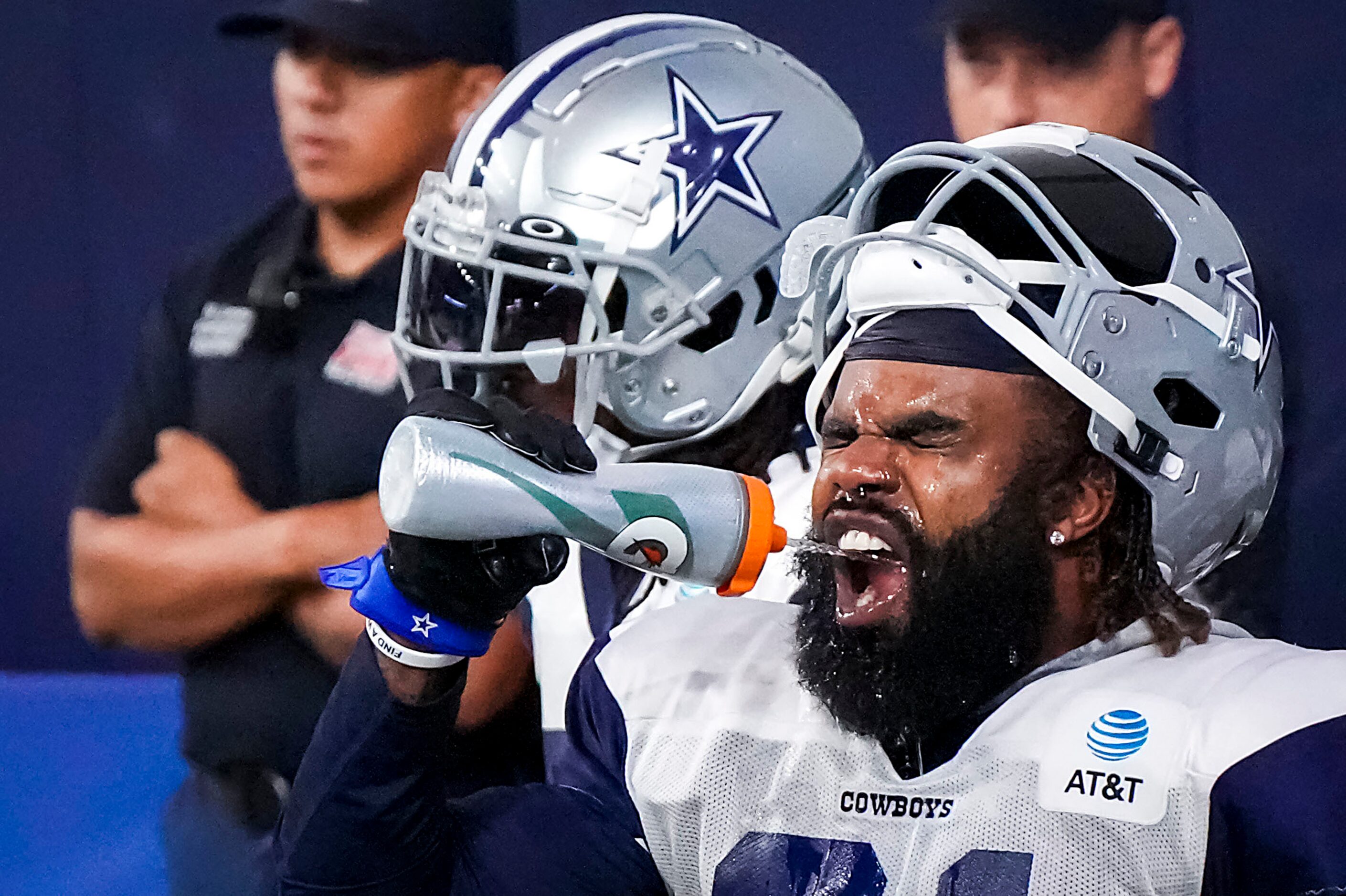 Dallas Cowboys running back Ezekiel Elliott cools off during a training camp practice at The...