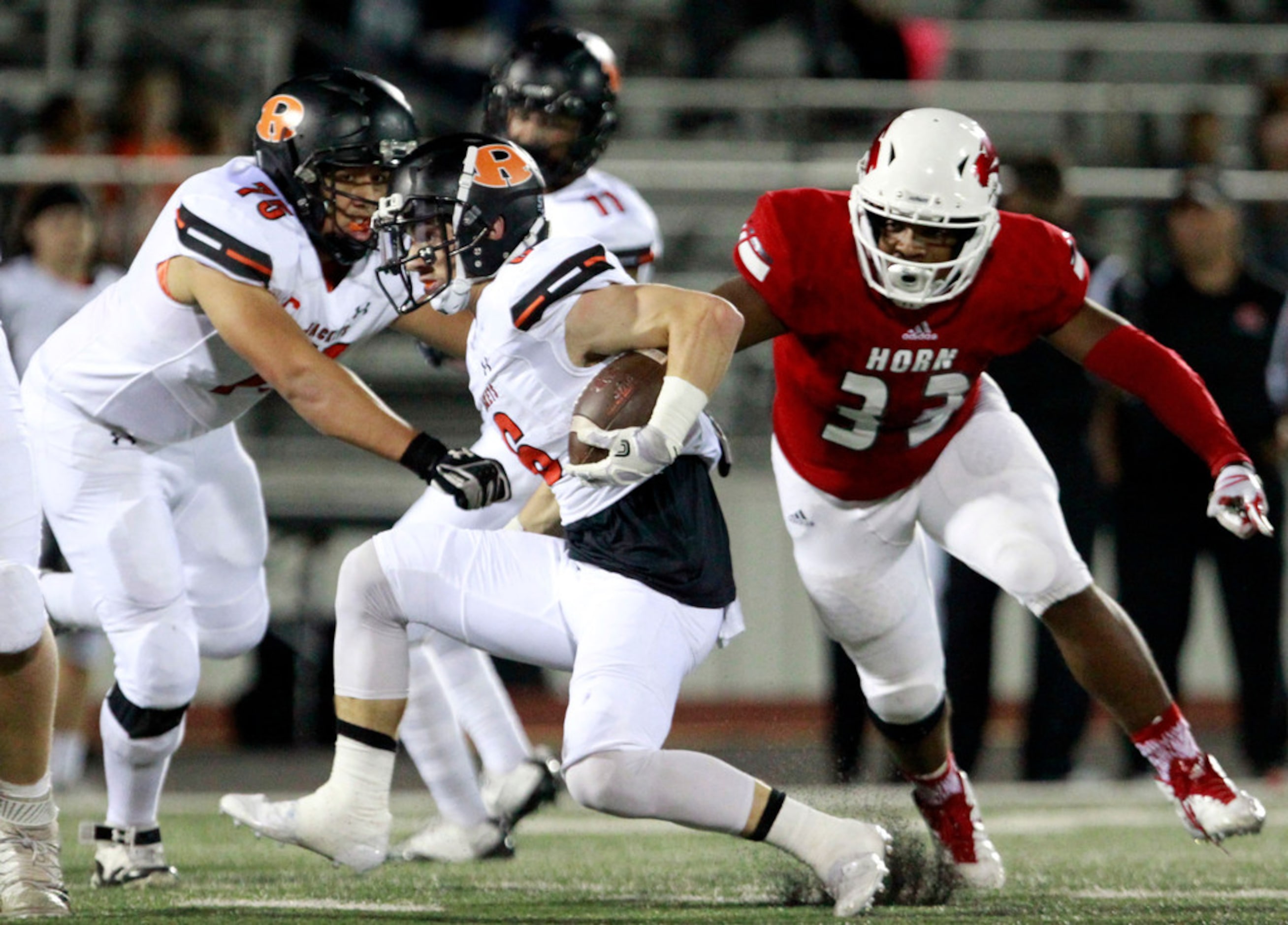 Rockwall' RB Zach Henry (6) goes low for a first down, as he is chased by Mesquite Horn...