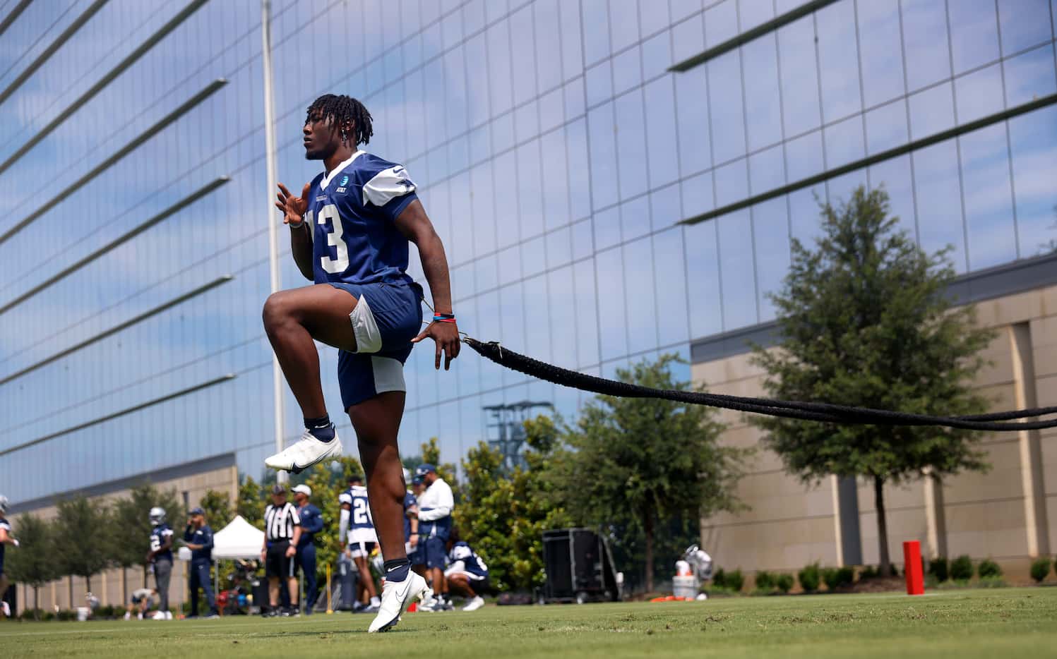 Dallas Cowboys linebacker DeMarvion Overshown (13) works out on an exercise band during the...